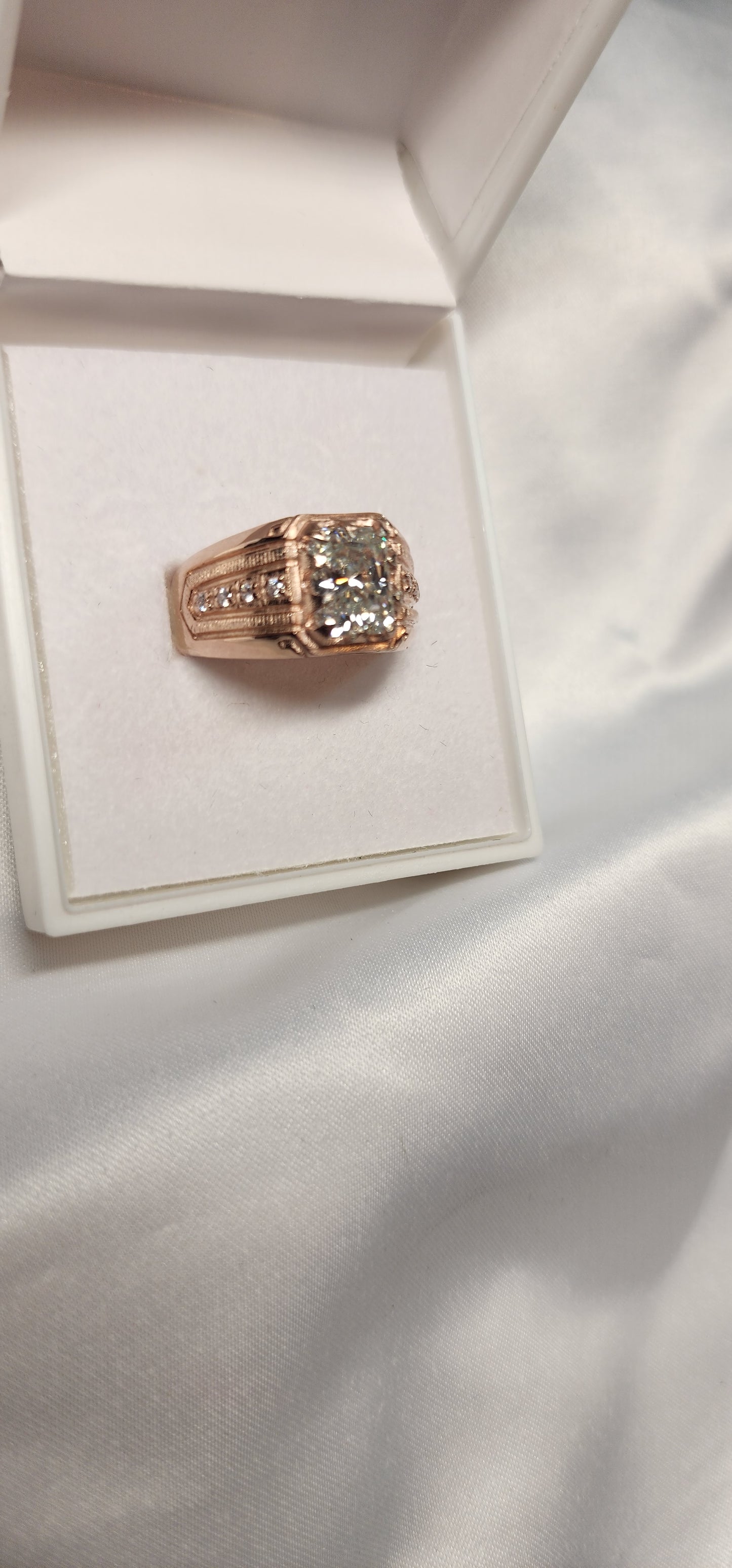 3ct Emerald Cut Moissanite Mens Ring Set in a vintage claw rose gold setting with detailed side stones. For Him. Wedding, Anniversary Ring.