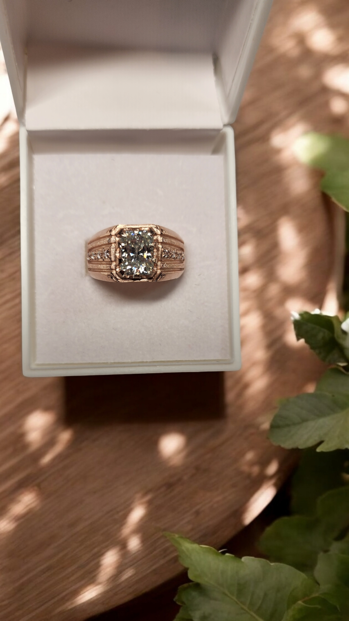 3ct Emerald Cut Moissanite Mens Ring Set in a vintage claw rose gold setting with detailed side stones. For Him. Wedding, Anniversary Ring.